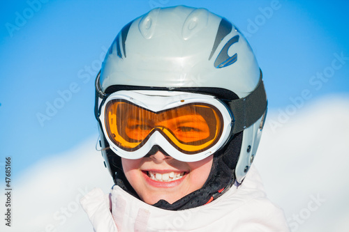 Photo: Young girl in a ski wear Young girl in a ski wear