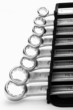 Closeup of iron spanners set over a white