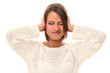 Foto: Young woman closing her ears in stress Young woman closing her ears in stress