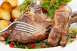 beef chops with potatoes and salad