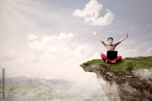 Photo: Girl student succeed on high mountain Girl student succeed on high mountain