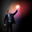 Businessman with light shining