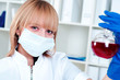 Foto: Chemist woman holding a test tube with red liquid Chemist woman holding a test tube with red liquid