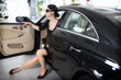 Photo: Elegant woman with long legs in car Elegant woman with long legs in car