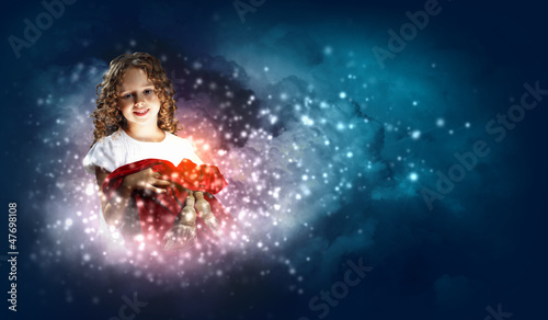 Photo: Happy girl opening gift box Happy girl opening gift box