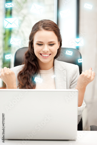 Photo: happy woman with laptop computer happy woman with laptop computer