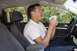 Man sneezing in car