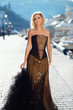 Woman in vintage dress walking along the promenade of Balaklava
