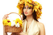 beautiful young woman with yellow autumn wreath and basket with