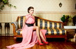 fashion young female model lady  sitting on the sofa