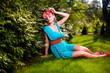 fashion young model lady  bright blue dress posing outdoors