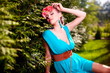 fashion young model lady  bright blue dress posing outdoors