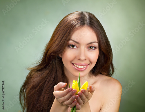 Photo: beautiful young women with tulip beautiful young women with tulip