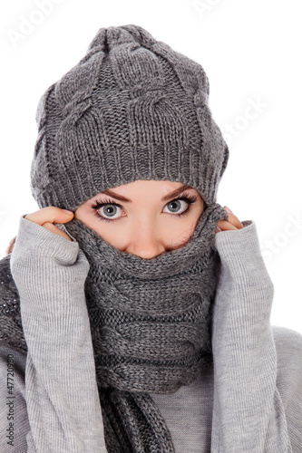 Photo: woman with hat and scarf, white background woman with hat and scarf, white background