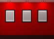 Gallery Interior with empty frames on red wall