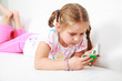 Small girl relaxing and reading