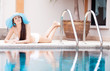 woman by the swimming pool