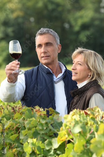 Photo: Winegrower with glass of wine Winegrower with glass of wine