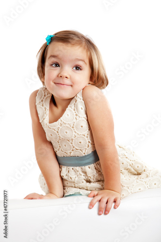 Photo: Cute playful little girl Cute playful little girl