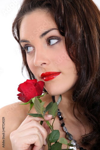 Photo: beautiful brunette with a red rose beautiful brunette with a red rose