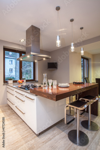 Photo: Travertine house - kitchen with TV Travertine house - kitchen with TV