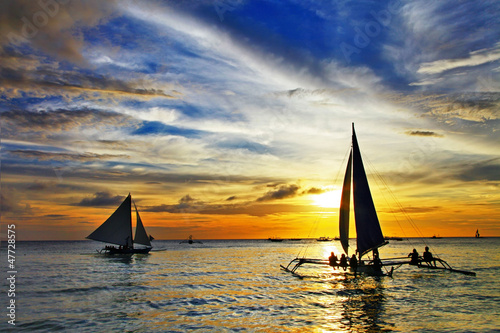 Photo: sailing on sunset. Boracay island,Philippines sailing on sunset. Boracay island,Philippines