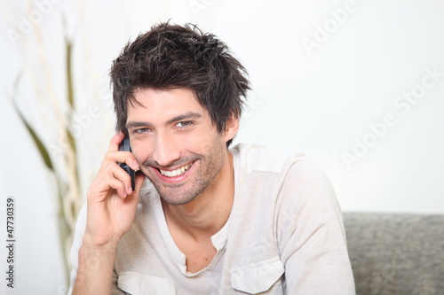 Photo: Black man on the phone Black man on the phone
