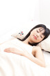 attractive asian woman sleeping in the bed
