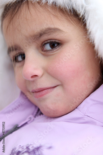 Photo: cute little girl in her winter coat cute little girl in her winter coat