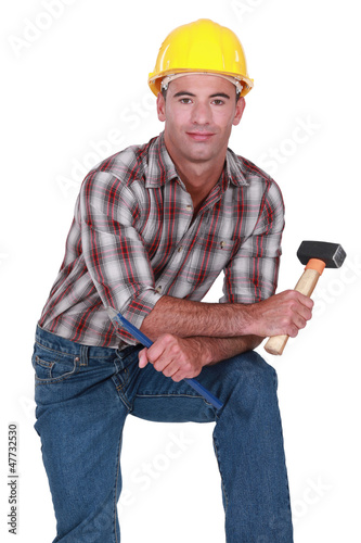 Photo: craftsman holding a huge hammer craftsman holding a huge hammer