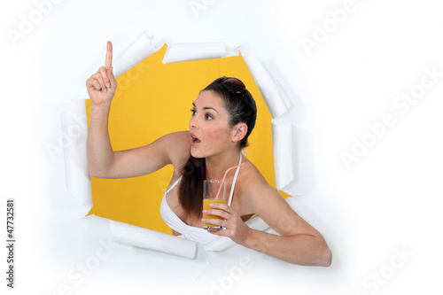 Photo: Woman with a glass of orange juice Woman with a glass of orange juice