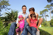 Photo: Young family gathered in the garden Young family gathered in the garden