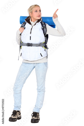 Photo: Woman carrying hiking backpack Woman carrying hiking backpack