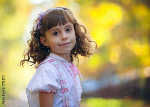 Photo: Portrait of a beautiful liitle girl close-up Portrait of a beautiful liitle girl close-up