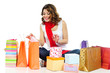 Happy girl looking for present in shopping bags