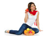 Beautiful young woman with basket of fruit