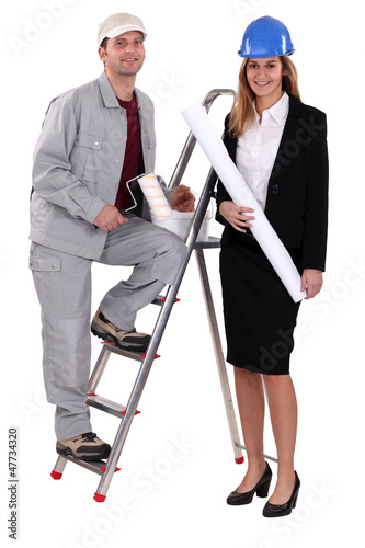 Photo: Painter and an architect working together Painter and an architect working together