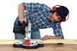 craftsman testing a new electric saw