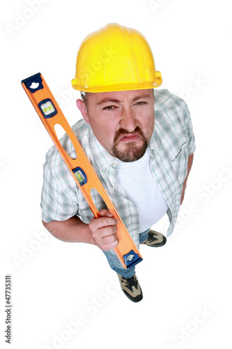 Photo: A angry handyman with a level. A angry handyman with a level.