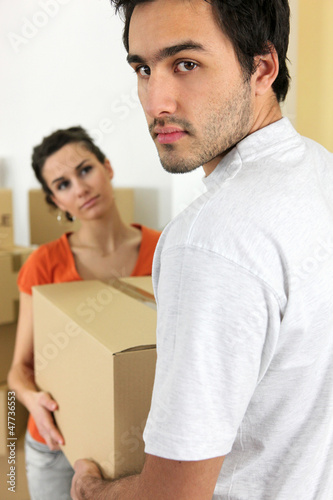 Photo: Couple moving cartons Couple moving cartons