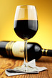Foto: Glass and bottle of fine italian red wine Glass and bottle of fine italian red wine