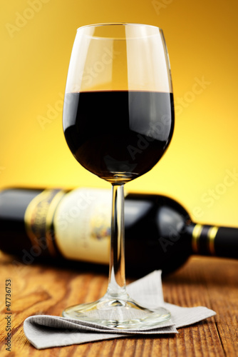 Photo: Glass and bottle of fine italian red wine Glass and bottle of fine italian red wine