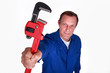 Plumber holding wrench