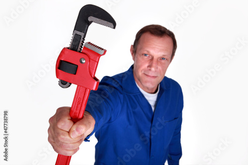 Photo: Plumber holding wrench Plumber holding wrench