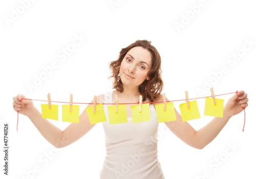 Photo: Beautiful woman holding a cord with sticky Beautiful woman holding a cord with sticky