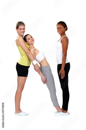 Photo: women doing fitness with a female coach women doing fitness with a female coach