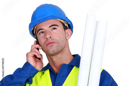 Photo: young blue collar on the phone young blue collar on the phone