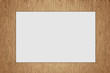 sheet of blank paper isolated on wood background