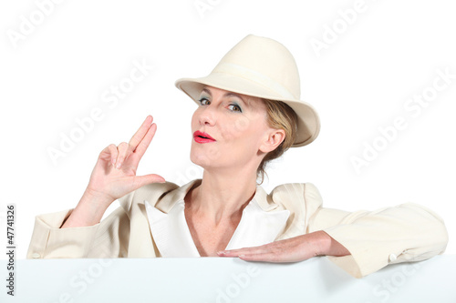 Photo: Blond woman in cream suite Blond woman in cream suite