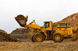 Yellow bulldozer in quarry